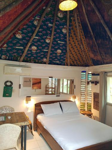 En eller flere senge i et værelse på La CASA - Guesthouse