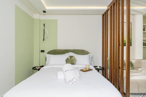 a bedroom with a large white bed with white pillows at The Nest Residence by GoodMove - Gauthier Casablanca in Casablanca