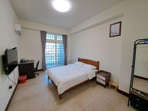 Postel nebo postele na pokoji v ubytování Xinyuan Guest House