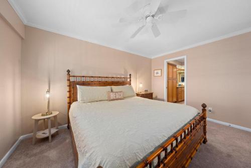a bedroom with a bed and a ceiling fan at Kings Crown 309 in Sanibel