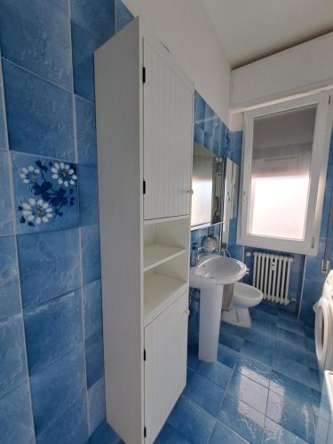a bathroom with a white cabinet and a sink at B&B Sabry in Casalecchio di Reno