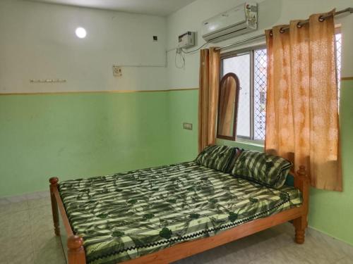 Postel nebo postele na pokoji v ubytování FullMoon Guesthouse