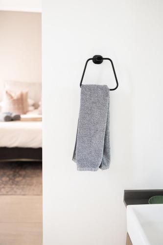 a kitchen with a towel hanging from a wall at 222 at Maine in Pretoria