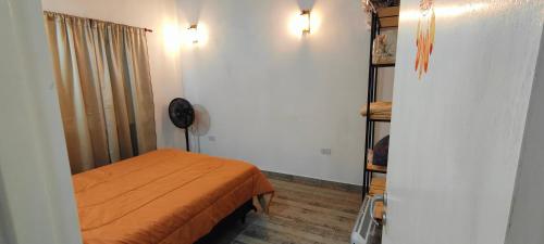 a small room with a bed and a closet at Antar Mouna in Cortaderas