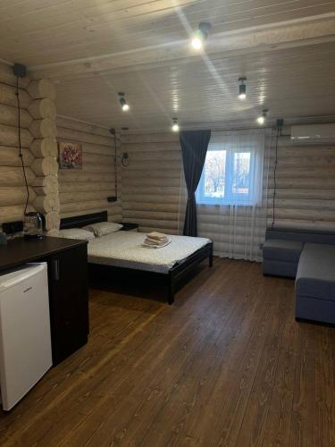 Ένα ή περισσότερα κρεβάτια σε δωμάτιο στο Авангард База Відпочинку