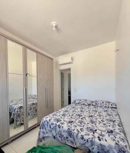 Un ou plusieurs lits dans un hébergement de l'établissement Apto Aconchegante