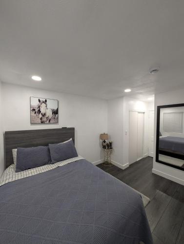 a bedroom with a bed and a flat screen tv at Rancho Las Casitas in Tucson