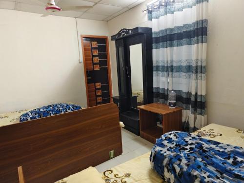 Postel nebo postele na pokoji v ubytování Hotel Priyashi International