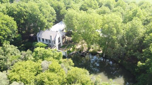 an aerial view of a house in the woods at The River Villa in Magaliesburg