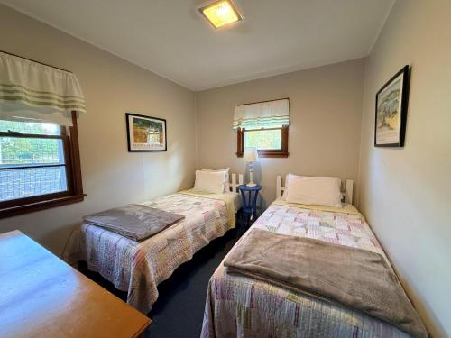 a room with two beds and a window at Brookhaven 5 in Maple City