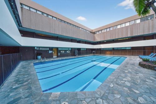 a swimming pool in the middle of a building at Chic DT Honolulu Executive Condo condo in Honolulu