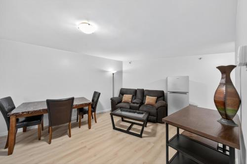 a living room with a couch and a table at Chic DT Honolulu Executive Condo condo in Honolulu