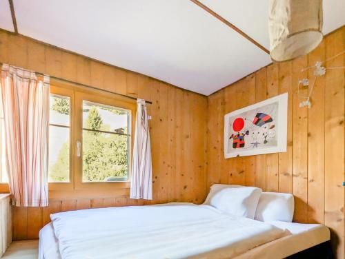 Appt dans chalet en pleine nature aux Mosses客房内的一张或多张床位