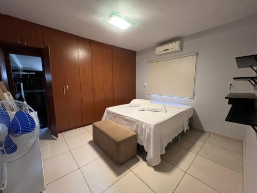 a hospital room with a bed and a chair at Casa para eventos e acomodações in Goiânia
