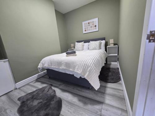 Ένα ή περισσότερα κρεβάτια σε δωμάτιο στο House 5 Minutes from Sefton Park