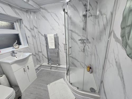 a bathroom with a shower and a sink at Room 3 Shared house 5 min from Sefton Park in Liverpool