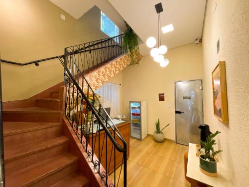 a staircase in a room with a stair case at Hotel Carmelita in Aparecida