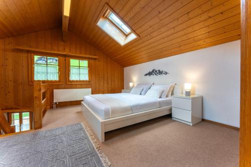 Ένα ή περισσότερα κρεβάτια σε δωμάτιο στο Chalet 3 - Quiet and unique near Interlaken