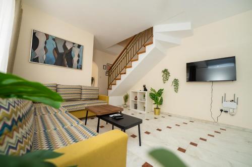 a living room with a couch and a table at 2 bedroom house near the beach in Limassol