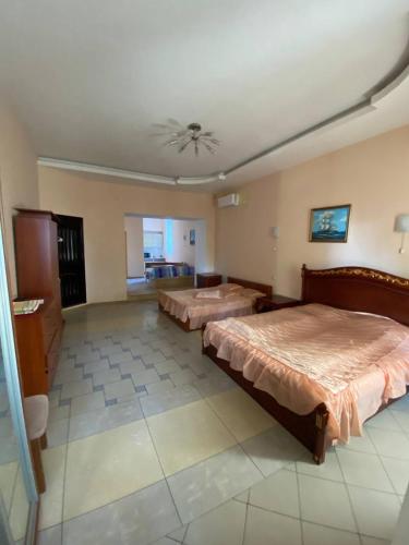 Postel nebo postele na pokoji v ubytování Апартотель Центр