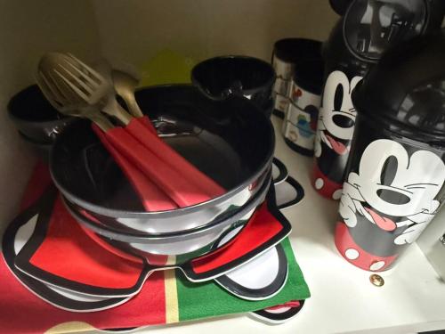 a pan with utensils in it on a counter at Luxury, Charm and Comfort in Guaratuba in Guaratuba