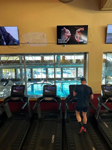 a man is standing in a bowling alley at Beaver Creek 2 Bed 2 Bath Condo 1 MIN Walk to Elk Lot in Avon