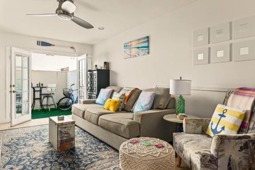 a living room with a couch and a table at Beach Front Bungalow at Pacific Beach in San Diego