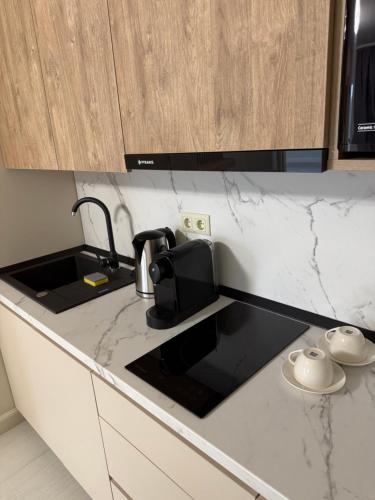 Kuchyň nebo kuchyňský kout v ubytování Golden Sky Residence