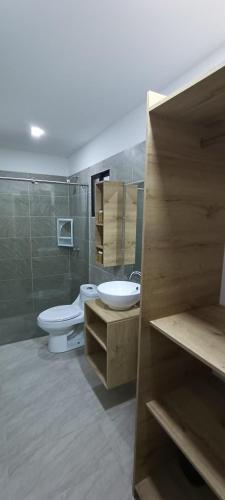 a bathroom with a toilet and a sink at Mango Beach in San Bernardo del Viento