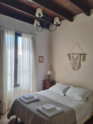 Postel nebo postele na pokoji v ubytování Casita Mumi