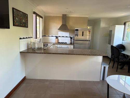 a kitchen with a counter top in a room at 2x1 granny flat close to Perth Airport in Perth