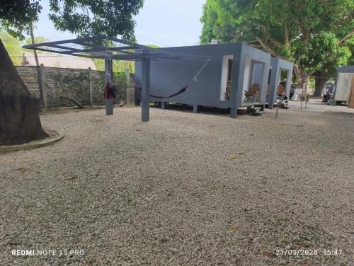 a playground with a hammock and a tent at Mango Beach in San Bernardo del Viento