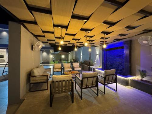 a living room with a table and chairs at عمان البحر الميت in Sowayma