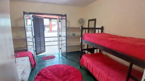 Ein Bett oder Betten in einem Zimmer der Unterkunft Casa no Condomínio Moana - Praia Martins de Sá