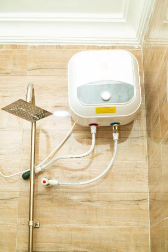 a water heater on the floor of a room at Soothing Haven2 in Ibadan