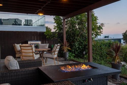 a patio with a fire pit and a table and chairs at Best Value in SD $1M Views; Great Location; WD in San Diego