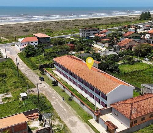 a town with a building with a yellow balloon on the roof at Apartamento Ilha Comprida in Ilha Comprida
