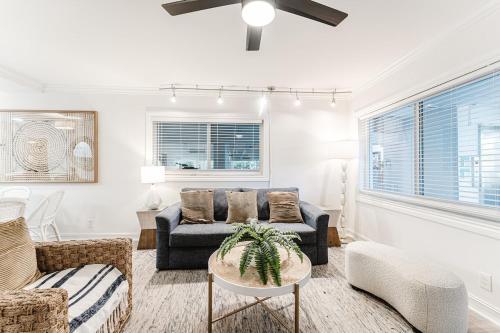 a living room with a couch and a table at Boca Intercoastal Stay by Aureum, Pool, Gym, Walk to Beach in Boca Raton