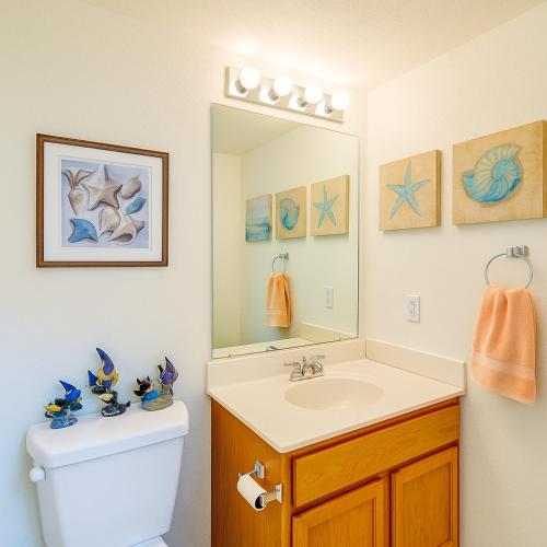a bathroom with a sink and a mirror at Blue River Oasis in Bullhead City