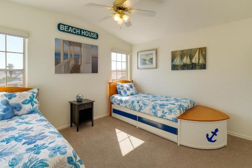 a bedroom with two beds and a sign that reads beach house at Blue River Oasis in Bullhead City