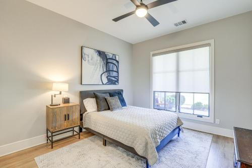 a bedroom with a bed and a window at Walk to Shops and Winery! Stylish Dtwn Ovilla Home in Glenn Heights