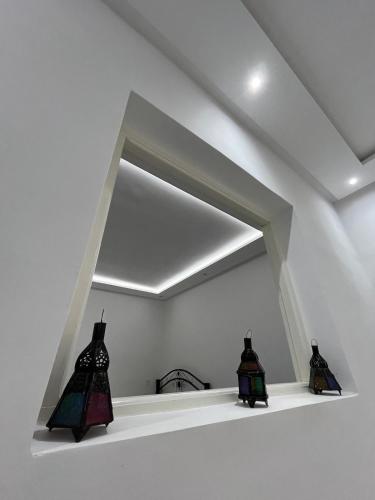 two pieces of art on a shelf in a room at Stylish Moroccan Apartment in Marrakesh