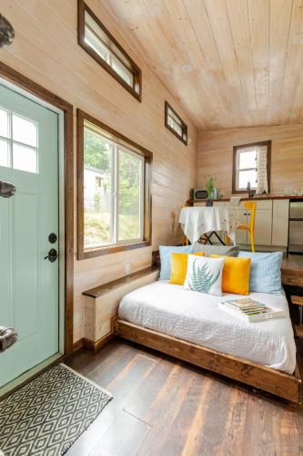 a bedroom in a tiny house with a bed at Tiny house on Flower Farm in downtown Atlanta in Atlanta