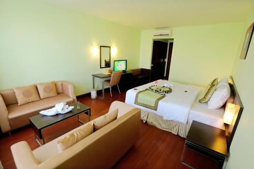 Una cama o camas en una habitación de Park View Hotel