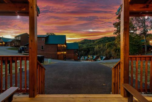 a sunset from the porch of a cabin at Spring into serenity, Your mountain hideaway is calling in Pigeon Forge