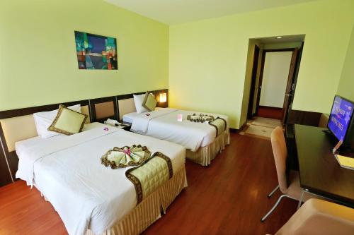 Una cama o camas en una habitación de Park View Hotel