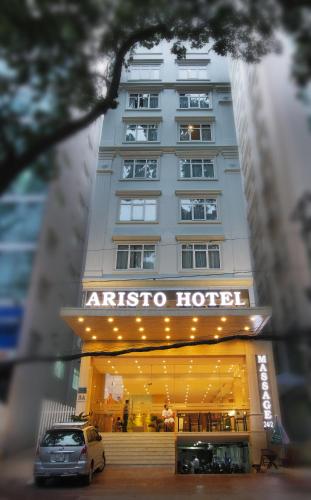 a car parked in front of a hotel at Aristo Saigon Hotel in Ho Chi Minh City
