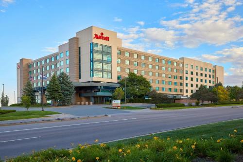 a large office building with a road in front of it at Denver Marriott South at Park Meadows in Lone Tree