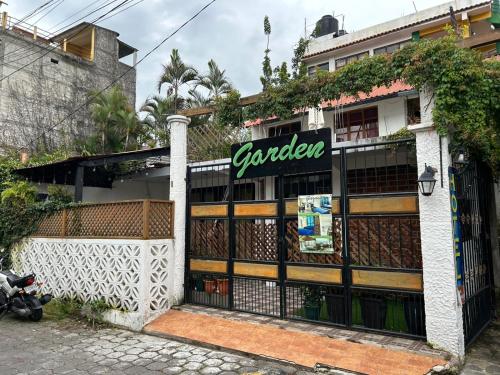 a store with a sign on the side of a building at Casa Garden in San Pedro La Laguna