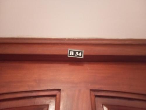 a close up of a door with the number on it at Guest Room Near Airport in Ariana